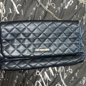 Moschino quilted cross body bag.